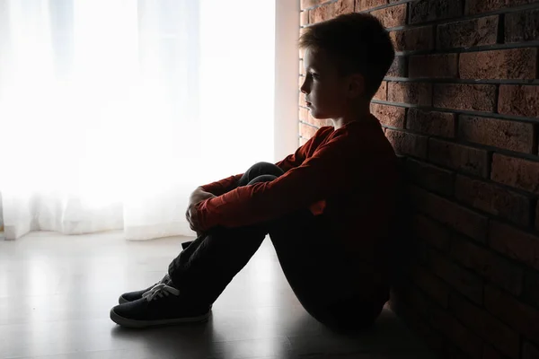 Sad Little Boy Sitting Brick Wall Domestic Violence Concept — 스톡 사진