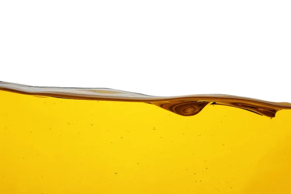 Tok oleje na vaření izolovaný na bílém. Barva tekutiny — Stock fotografie