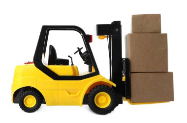 Oyuncak forklift ve beyaz kutular. Lojistik ve toptan