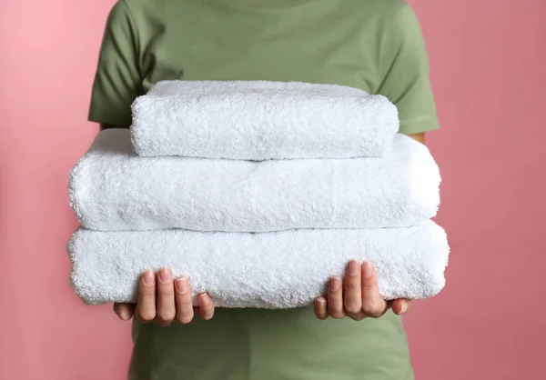 Woman Holding Stack Fresh Towels Pink Background Closeup — 스톡 사진