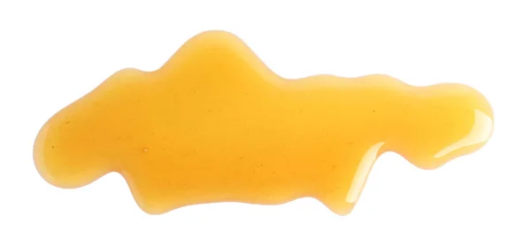 Miel dulce fresca derramada aislada de blanco —  Fotos de Stock