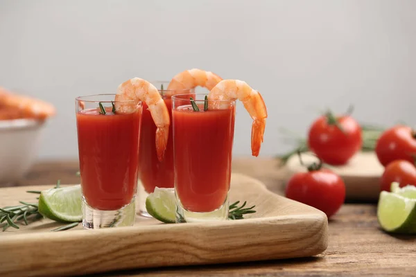 Shrimp cocktail with tomato sauce served on wooden table