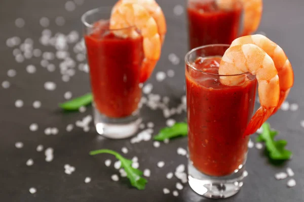 Delicious shrimp cocktail with tomato sauce served on black table