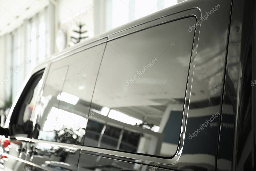 Modern car with tinting foil on window, closeup