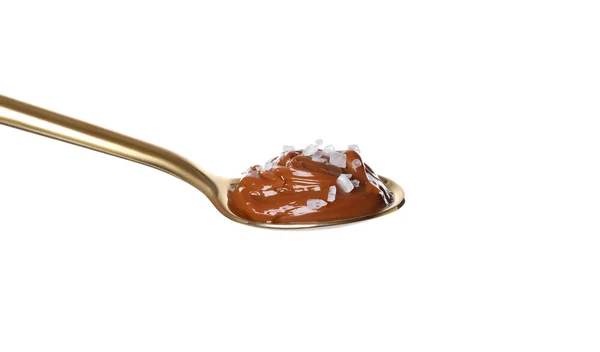 Solený karamel v lžíci izolované na bílém — Stock fotografie