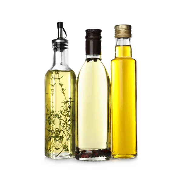 Verschiedene Arten von Speiseöl in Flaschen isoliert auf weiß — Stockfoto