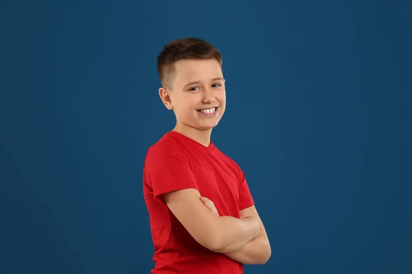 Portrait of preteen boy on blue background — 스톡 사진
