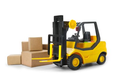 Oyuncak forklift ve beyaz kutular. Lojistik ve toptan