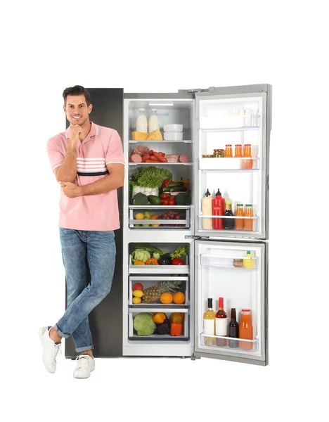 Человек Рядом Открытым Холодильником Белом Фоне — стоковое фото