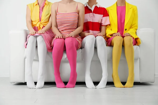 Women Wearing Colorful Tights Sitting Sofa Indoors Closeup — Stock Photo, Image