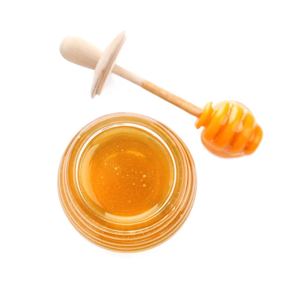 Jar of organic honey and dipper isolated on white, top view — Stok fotoğraf