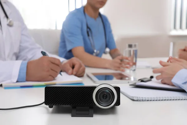 Video projector on table during medical conference