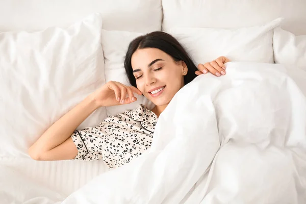 Young woman in bed at home, top view. Lazy morning — Stock Photo, Image