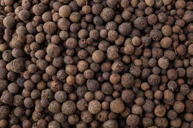 Arkaplan olarak karabiber taneleri, üst görünüm