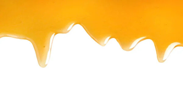 Verse zoete honing stroomt op witte achtergrond — Stockfoto
