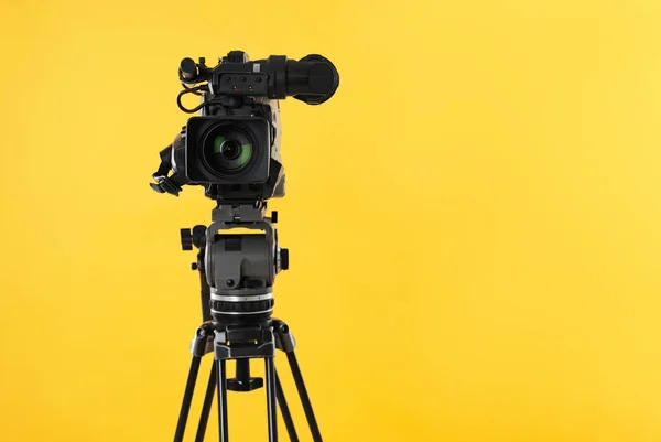 Modern Professional Video Camera Yellow Background Space Text — 스톡 사진