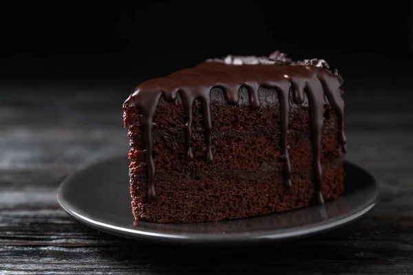 Delicious Chocolate Cake Black Wooden Table Closeup — Stock Photo, Image