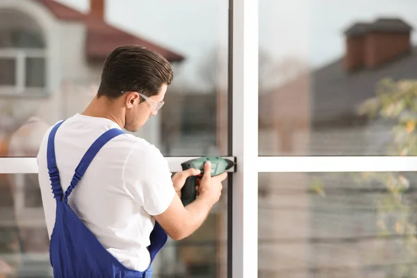 Construction Worker Repairing Plastic Window Electric Screwdriver Indoors — 스톡 사진