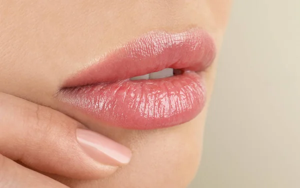 Woman with beautiful full lips on beige background, closeup — Stock Photo, Image