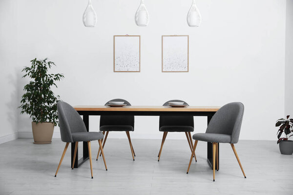 Stylish wooden table in modern room interior