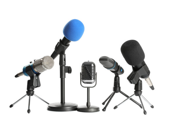 Set of different microphones isolated on white. Journalist's equ