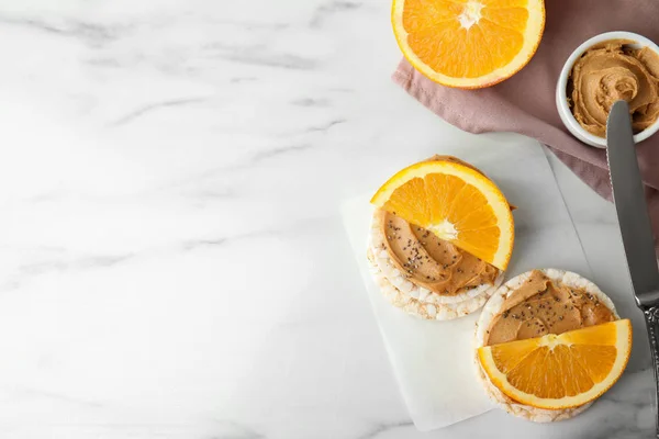 Puffed Rice Cakes Peanut Butter Orange White Marble Table Flat — 스톡 사진