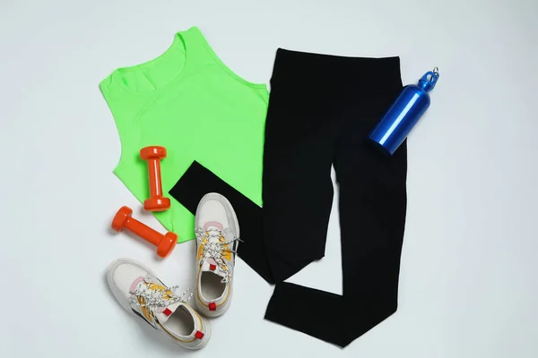Composition with sportswear on white background, top view — Stock Photo, Image