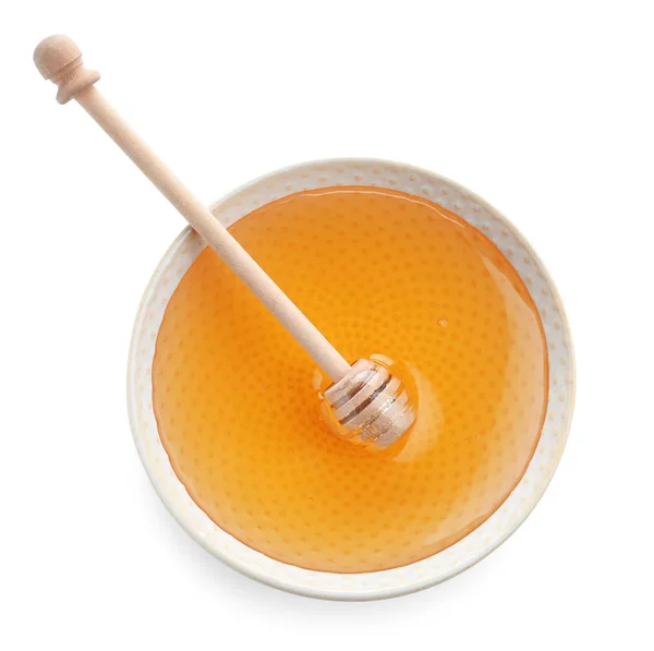 Bowl of organic honey and dipper isolated on white, top view — Stock Photo, Image
