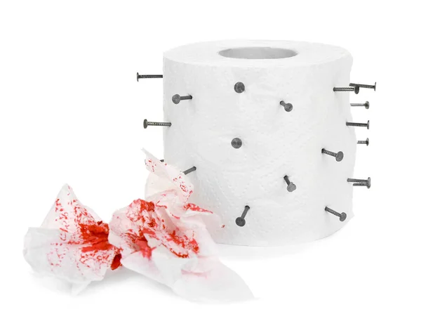 Roll of toilet paper with nails on white background. Hemorrhoid — 스톡 사진