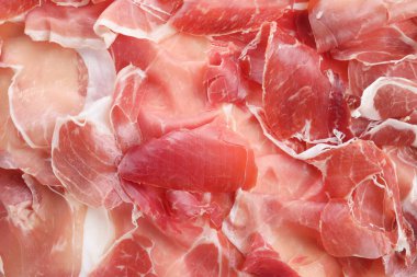 Lezzetli prosciutto dilimleri arkaplan olarak, üst görünüm