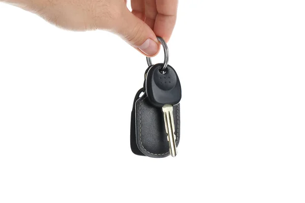 Man holding key on white background, closeup. Car buying — 스톡 사진