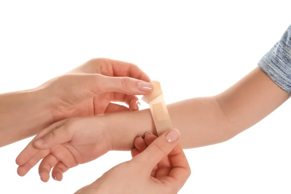 Mother Putting Sticking Plaster Son Arm White Background Closeup — 스톡 사진