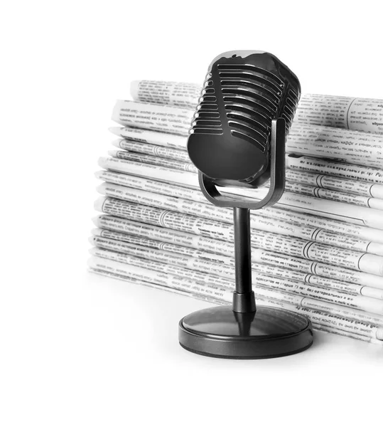 Newspapers and vintage microphone isolated on white. Journalist' — Stock Fotó