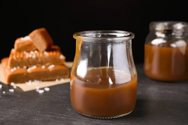 Salted Caramel Jar Grey Table — Stock Photo, Image