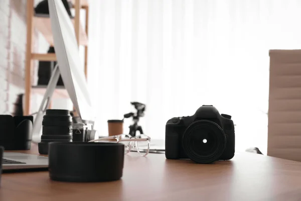 Photographer's workplace with professional camera in office — 스톡 사진