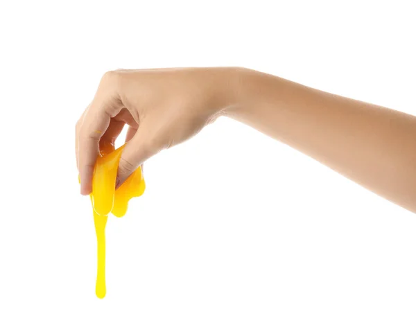 Woman playing with yellow slime isolated on white, closeup. Anti — 스톡 사진