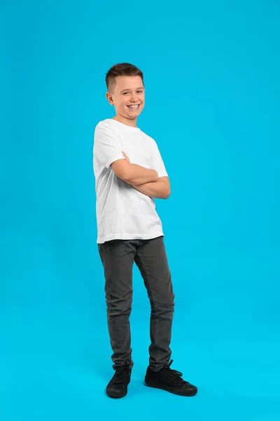 Full length portrait of preteen boy on light blue background — 스톡 사진