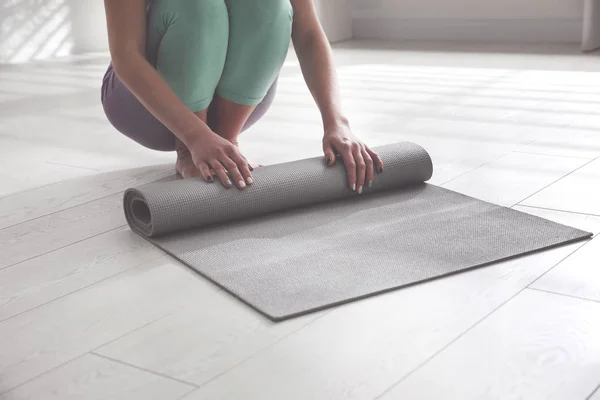 Woman Rolling Her Mat Floor Yoga Studio Closeup — Stock Photo, Image