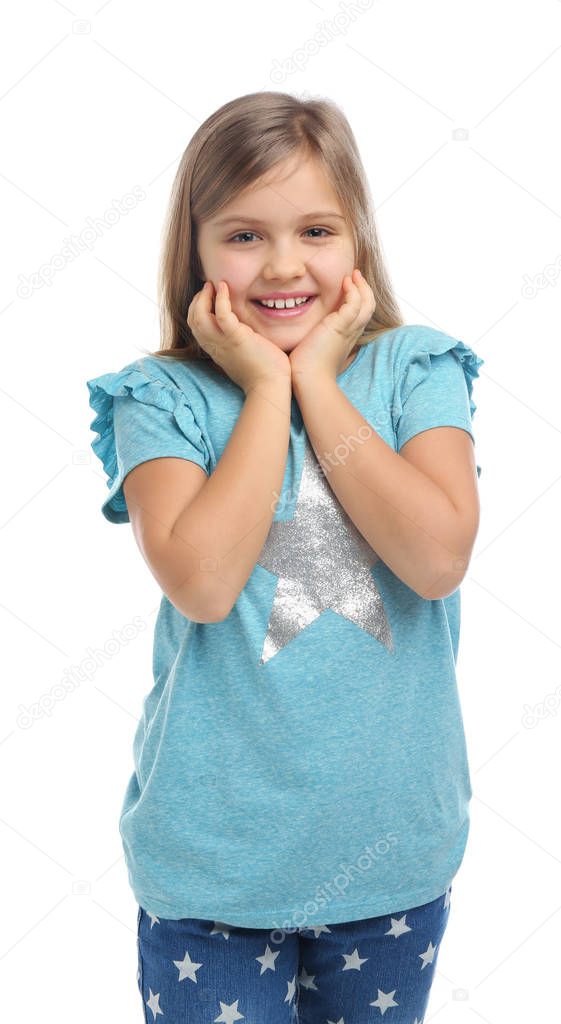 Surprised little girl in casual outfit on white background