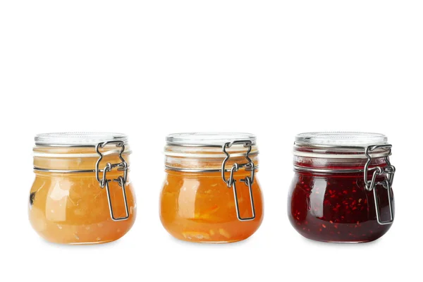 Jars of different delicious jams on white background — 스톡 사진