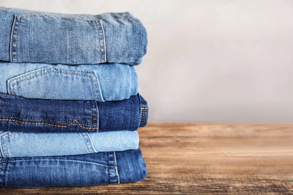 Stack Different Jeans Wooden Table Space Text — Stock Photo, Image