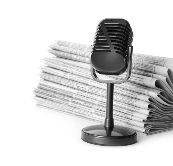 Newspapers and vintage microphone isolated on white. Journalist' — Stock Fotó