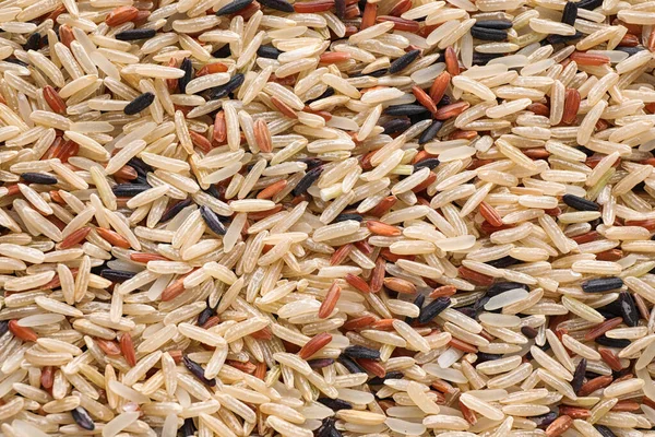 Mix Different Brown Rice Background Top View — Stock Photo, Image
