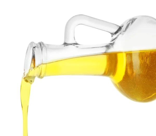 Pouring cooking oil from pitcher isolated on white — Stock Photo, Image