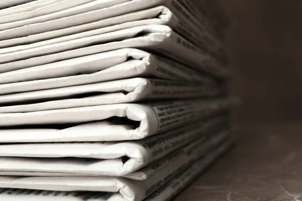 Stack of newspapers on table, closeup. Journalist's work — Stock Photo, Image