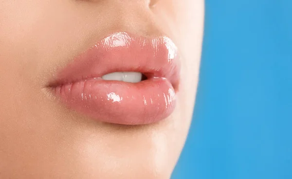 Young Woman Beautiful Full Lips Light Blue Background Closeup — 스톡 사진