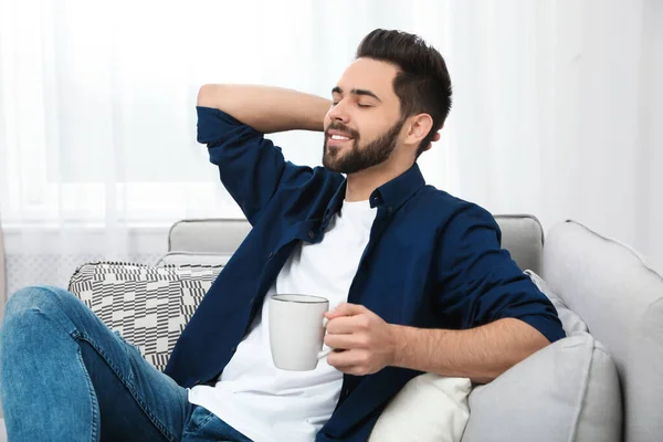 Young Man Cup Drink Relaxing Couch Home — 스톡 사진