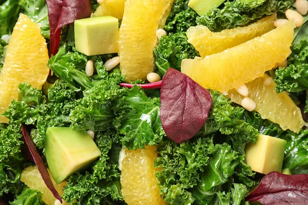 Tasty fresh kale salad as background, closeup