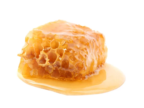 Piece of tasty fresh honeycomb isolated on white — ストック写真