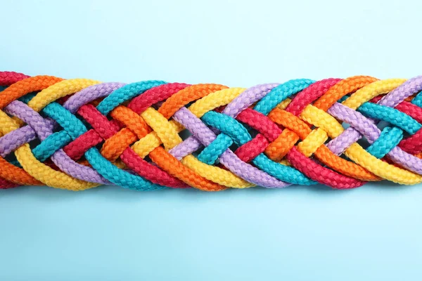 Braided Colorful Ropes Light Blue Background Top View Unity Concept — 스톡 사진
